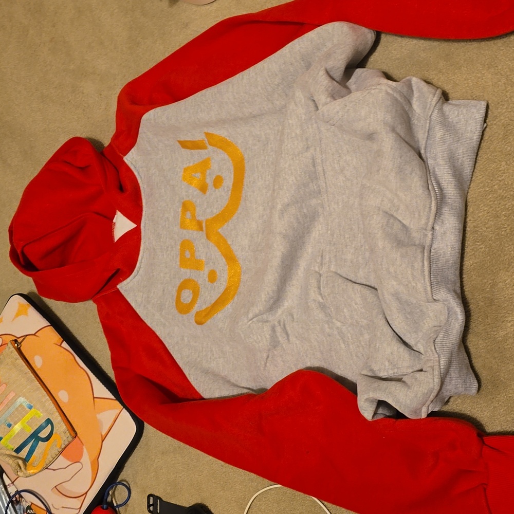 New gray and red sweater thst has the word oppai
